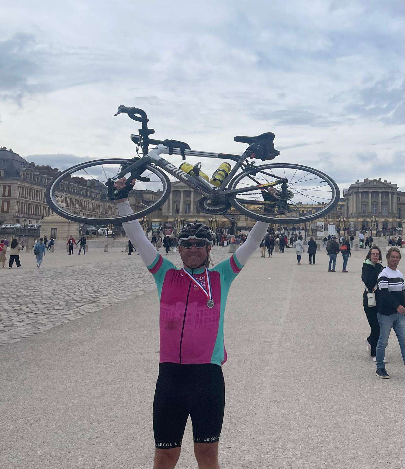 Nick holds Steve's bike aloft at Versaille